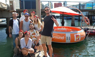 10 People about to jump on a orange round boat